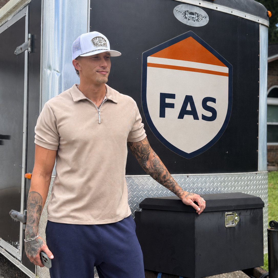 Connor Brown, owner of Fortified Asset Solutions, at his equipment trailer in Pensacola